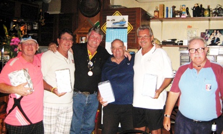 The winning 4-man scramble team receive their awards from birthday boy Bjarne, third left, and the Admiral, far right.